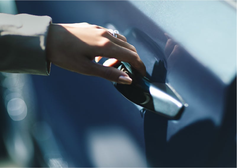 A hand gracefully grips the Light Touch Handle of a 2023 Lincoln Aviator® SUV to demonstrate its ease of use | Bill Collins Lincoln of Louisville in Louisville KY