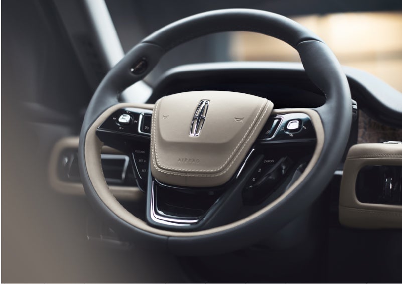 The intuitively placed controls of the steering wheel on a 2023 Lincoln Aviator® SUV | Bill Collins Lincoln of Louisville in Louisville KY
