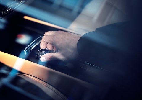 The driver of a 2023 Lincoln Corsair® SUV is shown adjusting the drive mode. | Bill Collins Lincoln of Louisville in Louisville KY
