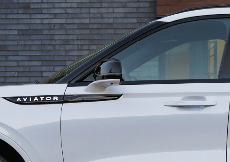 The driver’s door of a white 2025 Lincoln Aviator® SUV is showcased. | Bill Collins Lincoln of Louisville in Louisville KY
