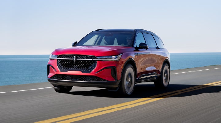 A 2025 Lincoln Nautilus® SUV is being driven on a seaside roadway. | Bill Collins Lincoln of Louisville in Louisville KY