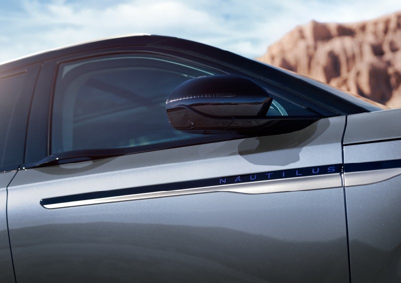 Blue lettering on the side of the vehicle that reads nautilus indicates the available hybrid powertrain. | Bill Collins Lincoln of Louisville in Louisville KY