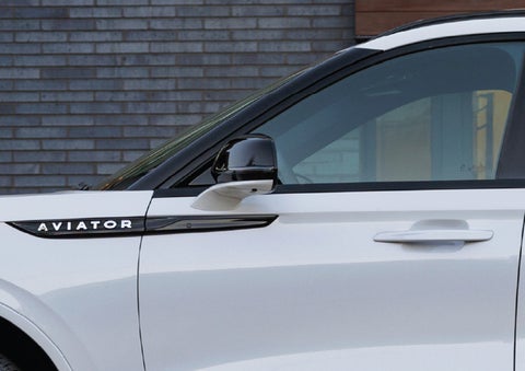 The driver’s side door and fender badging of a white 2026 Lincoln Aviator® SUV are showcased. | Bill Collins Lincoln of Louisville in Louisville KY