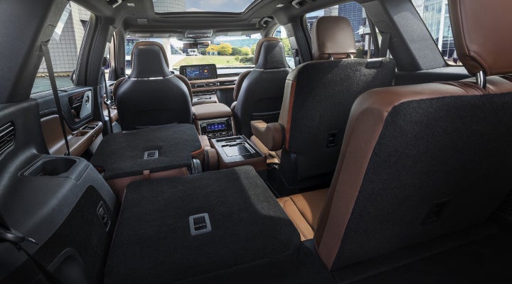 One side of the PowerFold® third-row seat and a second-row seat are folded forward in the 2026 Lincoln Aviator® SUV. | Bill Collins Lincoln of Louisville in Louisville KY