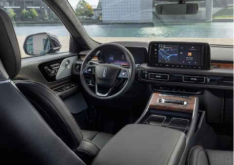The interior of the 2026 Lincoln Aviator® SUV is shown parked with a view of a harbor through the windshield. | Bill Collins Lincoln of Louisville in Louisville KY