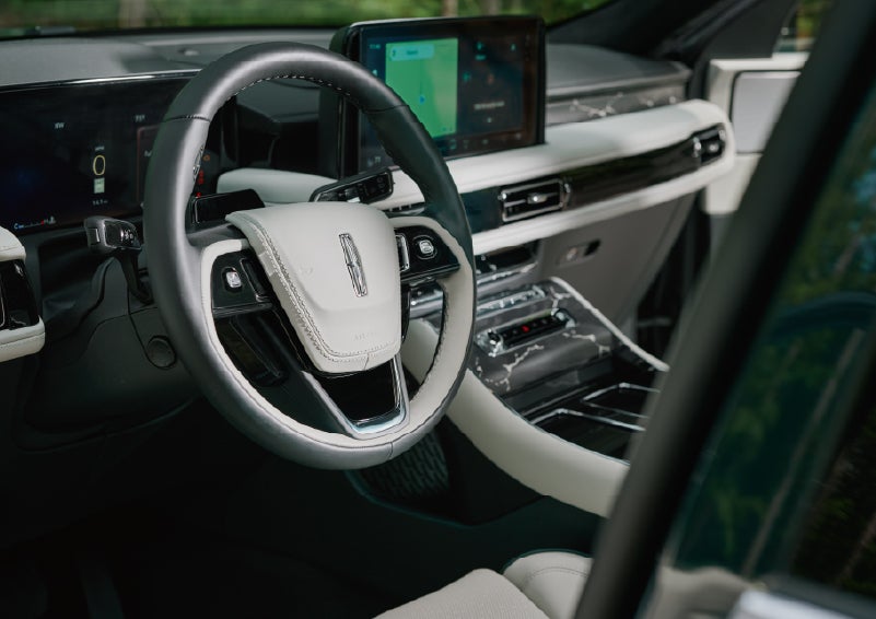 The leather-trimmed steering wheel of a 2027 Lincoln Aviator® Black Label™ SUV. | Bill Collins Lincoln of Louisville in Louisville KY