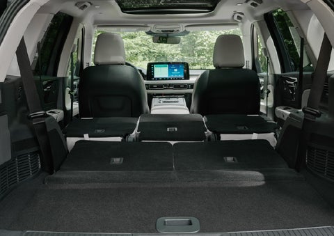 A rear to front view of the interior of a 2027 Lincoln Aviator® Black Label™ SUV shows the third and second rows folded flat | Bill Collins Lincoln of Louisville in Louisville KY