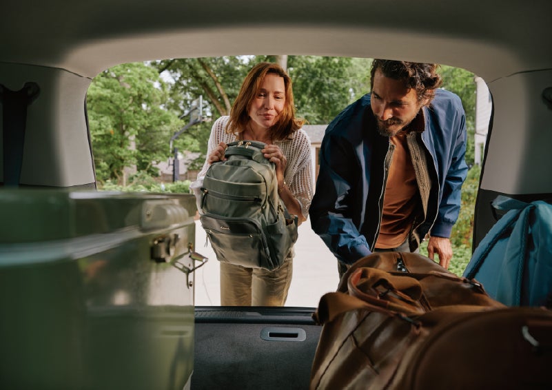 A couple loads luggage into the rear of a 2027 Lincoln Aviator® Black Label™ SUV..e 202 | Bill Collins Lincoln of Louisville in Louisville KY